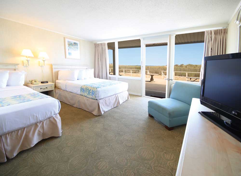 guest room with 2 beds, looking outside